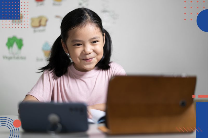 A small girl attending an online PSLE learning session with StudySmart mobile app.