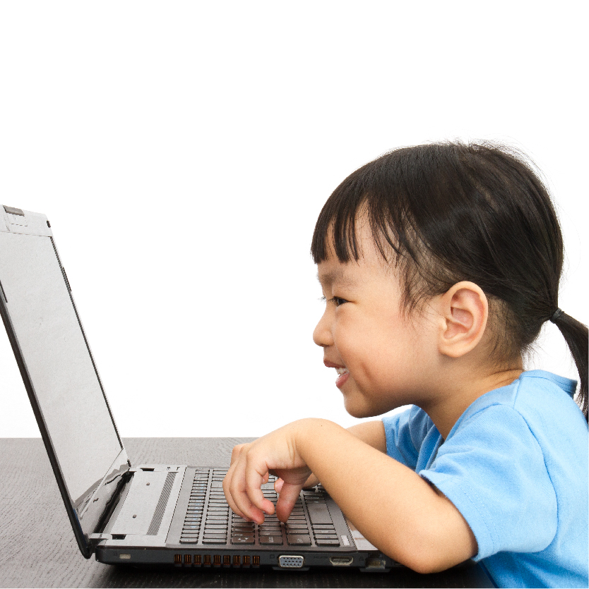 A young child engrossed in a PSLE learning session in front of a laptop.