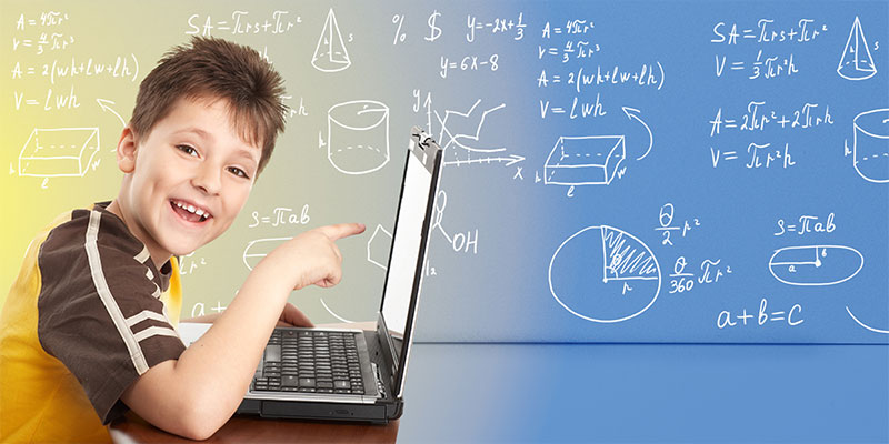 With an abstract background of math formulas, a happy young boy poses with his laptop.