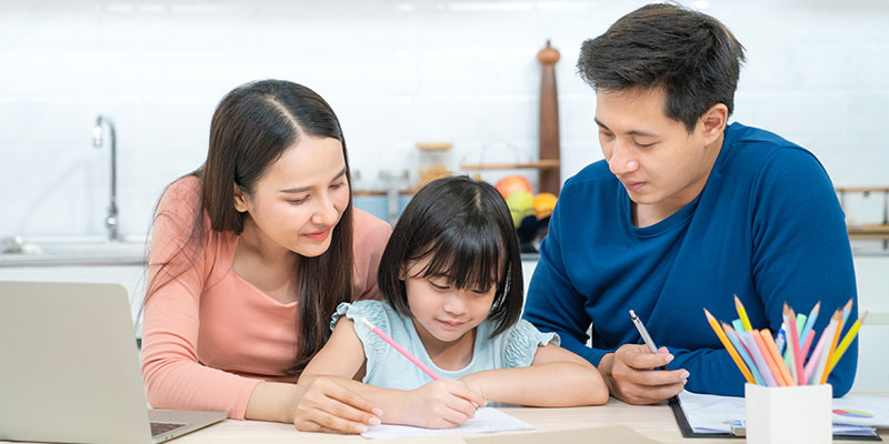 Mother and father teach PSLE Science concepts to their child and make her revise them.