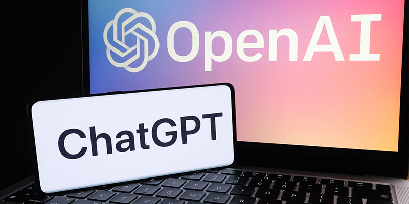 ChatGPT logo seen on a smartphone and OpenAI company logo displayed on a laptop illustrates ChatGPT's defeat by Singapore's PSLE exam questions.